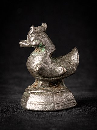 Bronze opium weight from Burma (Myanmar), animal-shaped piece on stepped base in side view