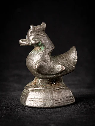 Bronze opium weight from Burma (Myanmar), animal-shaped piece on stepped base in side view