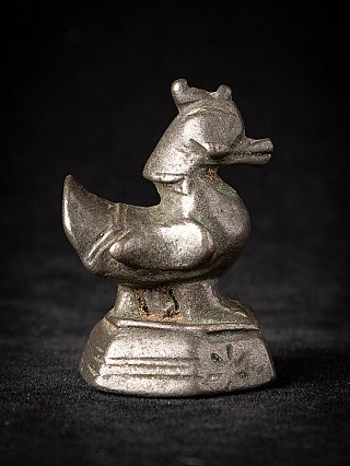 Bronze opium weight from Myanmar, animal-shaped form on base in opposite side view