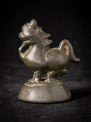 Burmese bronze opium weight, animal-shaped figure in side view on a rounded base