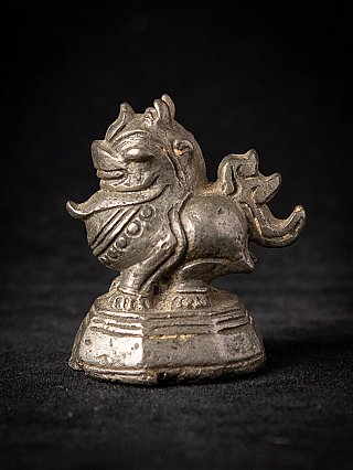 Antique bronze opium weight from Burma (Myanmar), animal figure on base in three-quarter view