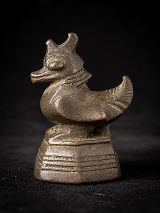 Burmese bronze opium weight, animal-shaped piece on stepped base in side profile