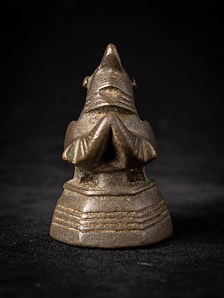 Antique bronze opium weight, rear view showing the tail and stepped base