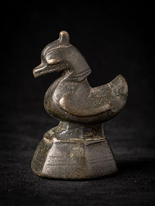 Antique Burmese bronze opium weight in bird form on stepped base, side view