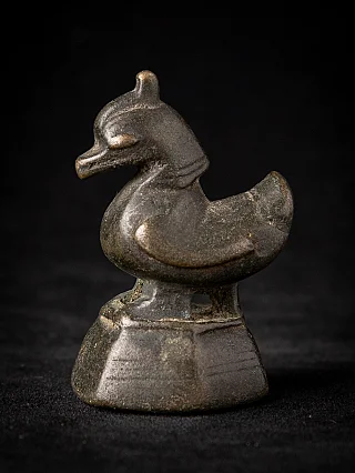 Antique Burmese bronze opium weight in bird form on stepped base, side view