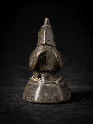 Burmese bronze opium weight, rear view showing the tail and stepped base