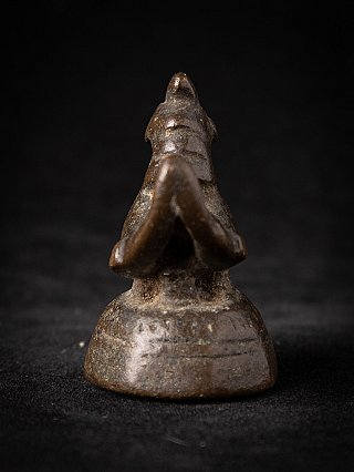 Burmese bronze opium weight, rear view showing tail and rounded base