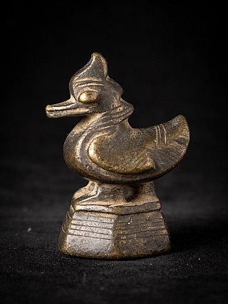 Bronze opium weight from Burma (Myanmar), bird-shaped form on stepped base, left side view