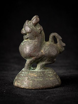 Bronze opium weight from Burma (Myanmar), animal figure on round base in left side view