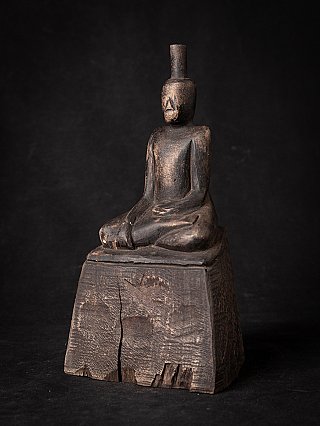 Burmese wooden Buddha statue on tall base, three-quarter view