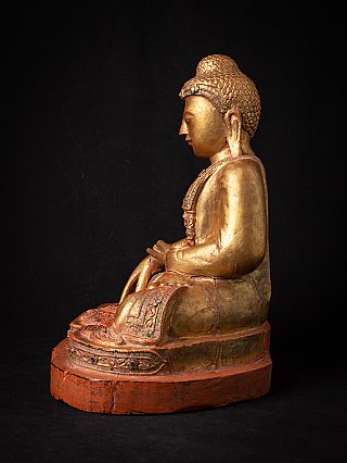 Buddha statue from Burma, Mandalay period, left side profile with red base