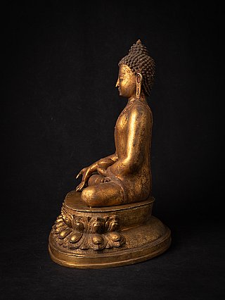 Nepalesische Bronze-Buddha-Statue in linker Seitenansicht, sitzend auf rundem Lotussockel