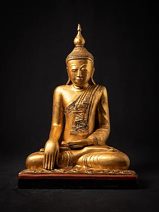 Old wooden Burmese Buddha statue