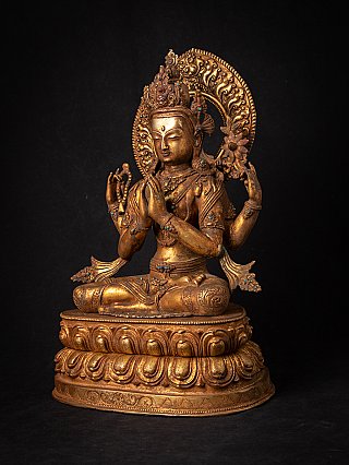 Chenrezig bronze statue from Nepal in three-quarter view, showing crown and halo