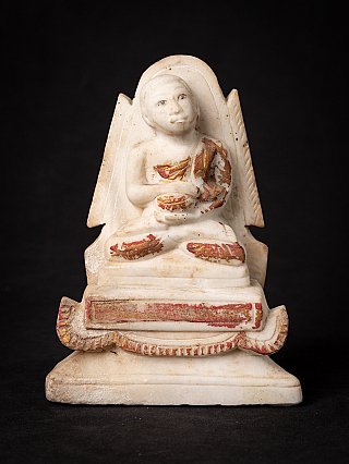 Burmese marble monk statue, seated with red and gold pigment traces, full front view