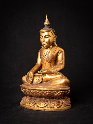 Old wooden Burmese Buddha statue