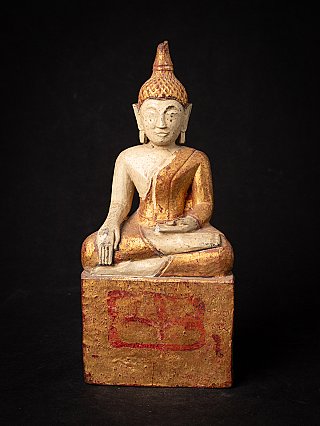 Thai Lanna Buddha statue in wood, seated in bhumisparsha mudra, full front view