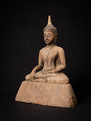 Wooden Buddha statue from Thailand, three-quarter left view, seated with earth-touching gesture