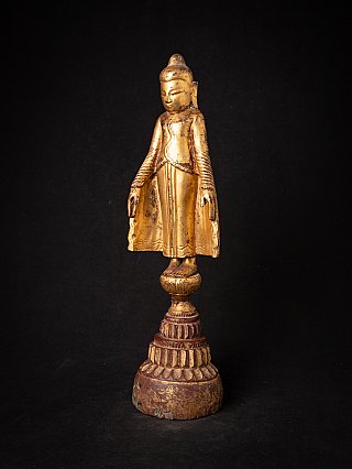 Ava-style Burmese wooden Buddha statue with gilding, three-quarter left view