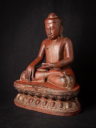 Burmese wooden Buddha statue seated on lotus base in bhumisparsha mudra, three-quarter view