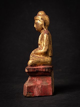 Burmese wooden Buddha statue, side profile view