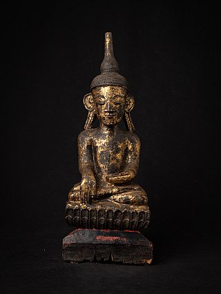 Burmese wooden Buddha statue seated on lotus base, front view with worn gilding