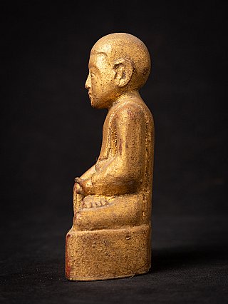 Antique Burmese wooden monk statue, right side profile on base