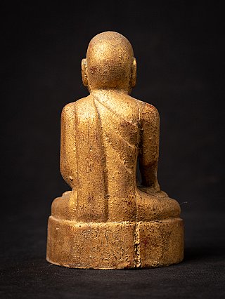 Seated Burmese wooden monk statue, rear view showing robe down the back