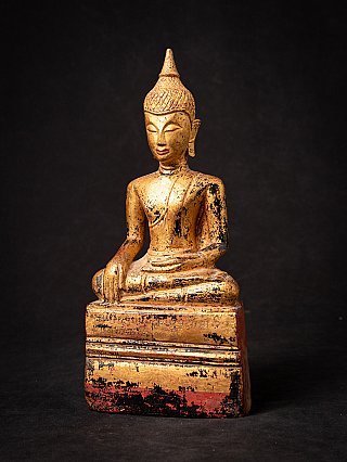 Antique wooden Thai Buddha statue