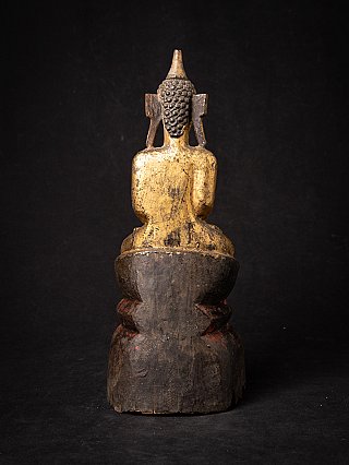 Wooden Burmese Buddha statue with worn gilding, rear view of head and back