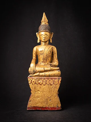 Wooden Tai Lue Buddha statue from Laos, seated in bhumisparsha mudra, full-front view