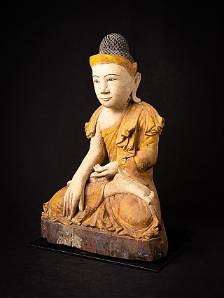 Burmese wooden Buddha statue seated, three-quarter right view