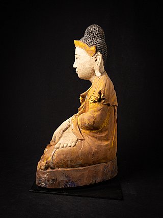Wooden Buddha statue from Burma seated, left side profile