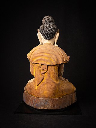 Burmese wooden Buddha statue, rear view showing robe folds and hair texture