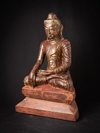 Burmese wooden Buddha statue in bhumisparsha mudra, three-quarter right view