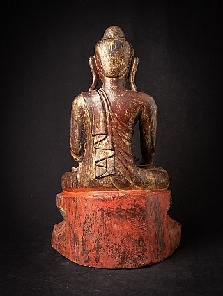 Burmese wooden Buddha statue, rear view showing robe drapery and red base