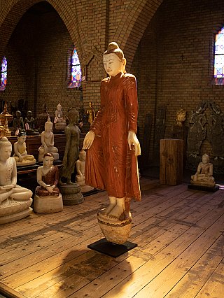Burma marble Buddha statue, three-quarter view showing robe folds and pedestal