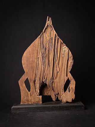 Rear view of the wooden panel backing of the Burmese Buddha statue, showing heavy wear and losses