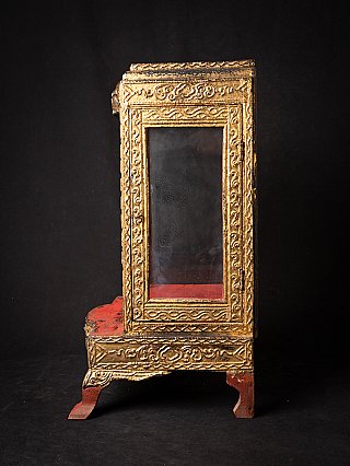 Burmese wooden shrine, Mandalay period, side view with gilded frame and glass window