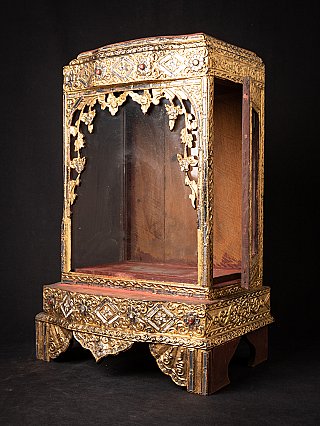 Wooden Burmese Buddha temple, three-quarter view with open front and visible interior
