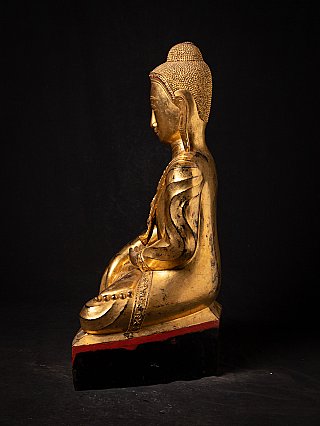 Seated Burmese Buddha statue in lacquerware, left side profile with base
