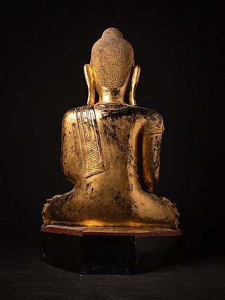 Burmese lacquerware Buddha statue, rear view showing the robe drape and surface wear