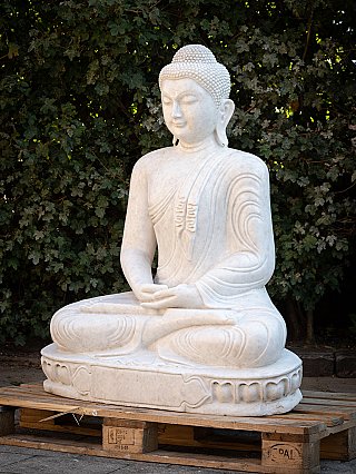 Marble Buddha statue from Burma (Myanmar) seated on lotus base, three-quarter view