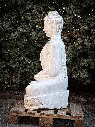 Burmese marble Buddha statue seated, side profile showing the lotus base