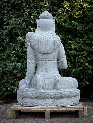 Dewi Tara stone statue, rear view showing the back and headdress from behind