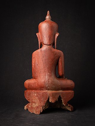 Antique wooden Burmese Buddha statue, rear view with back and damaged base