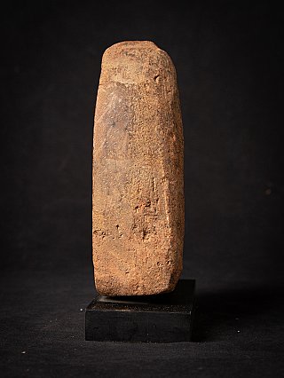 Side profile of the Bagan votive tablet showing the worn, textured surface