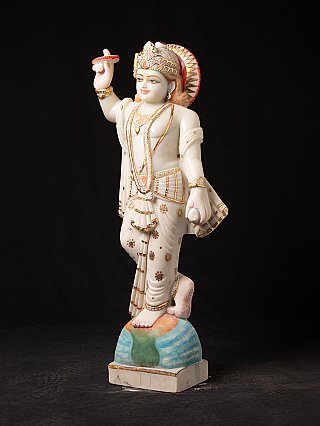 Marble Vishnu statue from India, three-quarter view showing halo and painted details