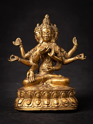 Namgyälma Buddha statue in Tibetan bronze, full front view with multiple arms and faces