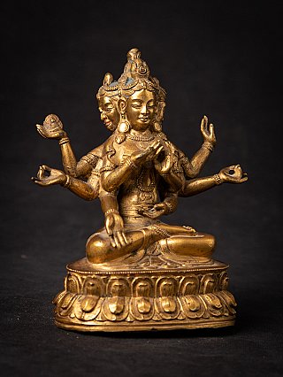 Namgyälma Buddha statue in Tibetan bronze, angled front view with multiple hand gestures